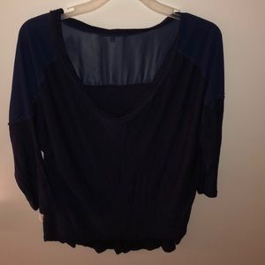 a blue mid-sleeve blouse